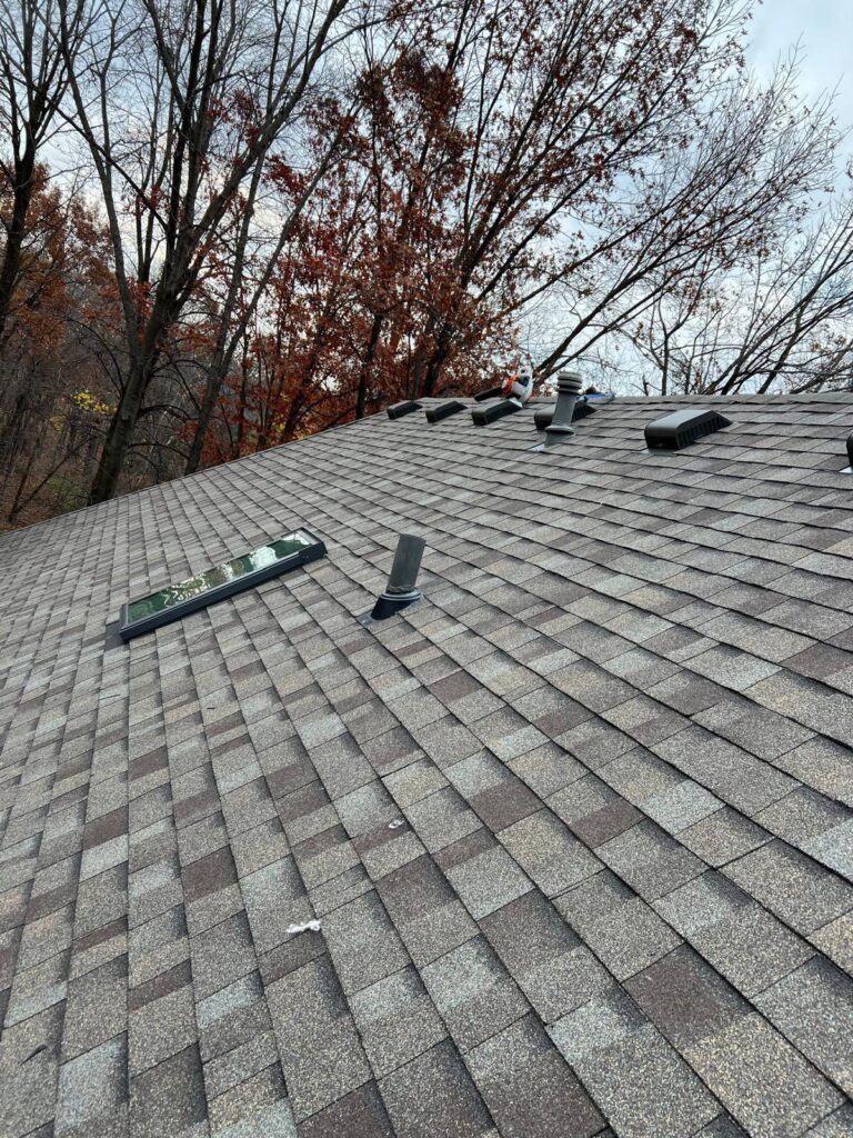 an image of a roof repair job on a house near moline, il