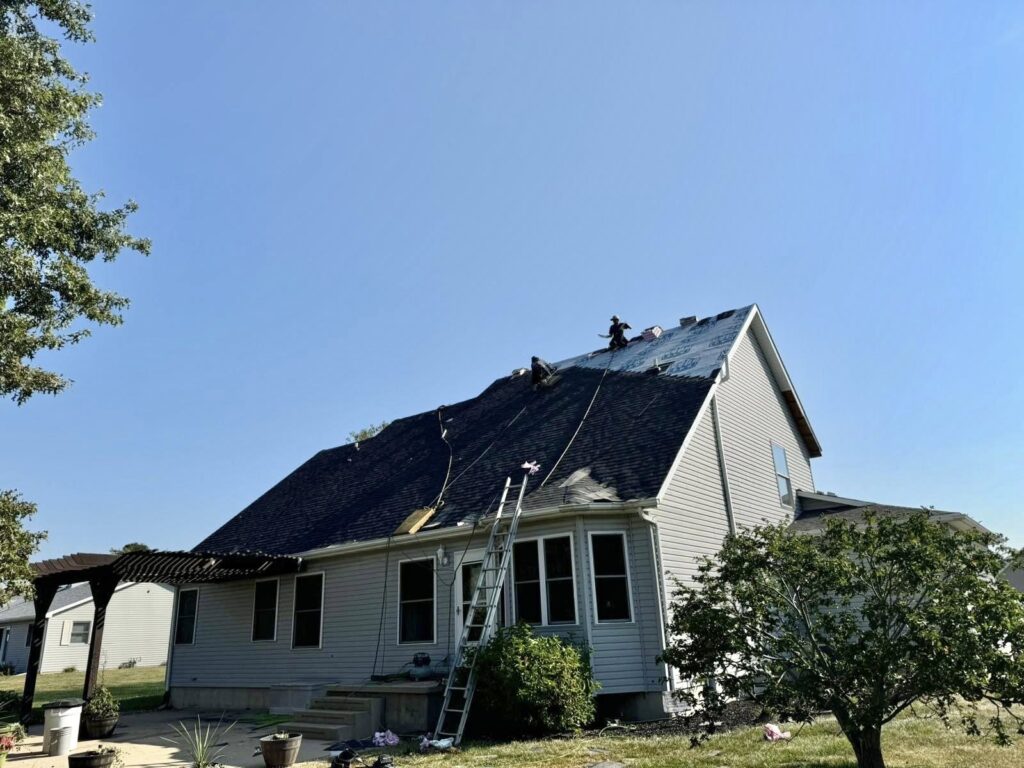 image of roofing contractor repairing a roof near Moline, IL